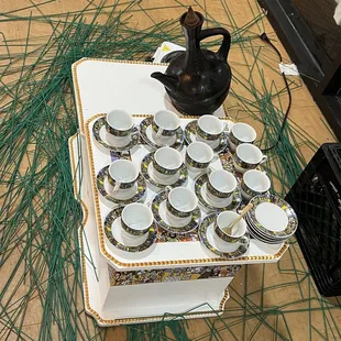 a tray of cups and saucers