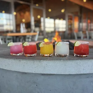 a row of cocktails