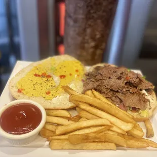 a plate of french fries and a sandwich