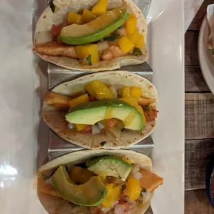 Salmon fish taco included mango, avocado, pico de gallo and a light and tasty mango sauce.