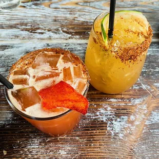 two cocktails on a wooden table