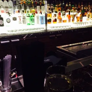 a bar with a variety of liquors