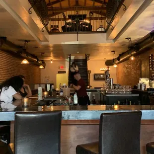 a restaurant with a long bar