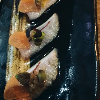 Yellowtail Sashimi, Shallots, Poached Garlic Ponzu, Serrano Chili*