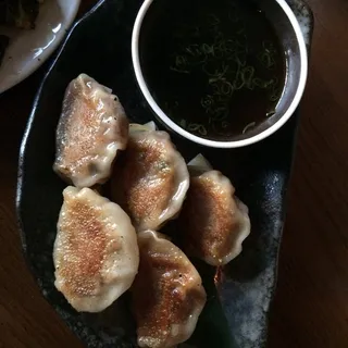 Prime Beef and Kimchi Dumplings, Soy Vinaigrette**