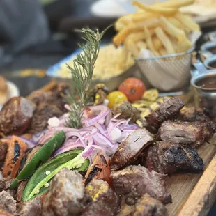 a platter of meat and vegetables