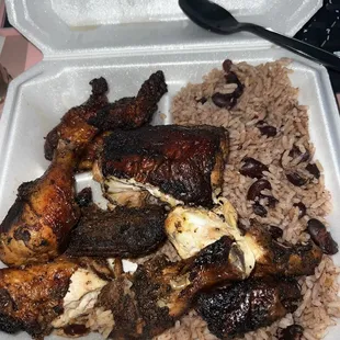Jerk chicken dark meat dinner with rice and peas and fried plantain
