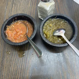 Red and green salsas, both serves warm with tasty tortilla chips
