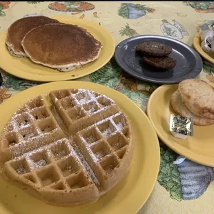 Waffle, two pancakes, biscuit and sausage patties.