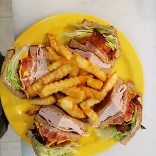 Club sandwich with fries