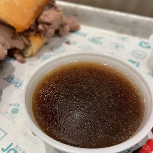 a bowl of soup and a sandwich