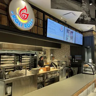 a restaurant with a large screen