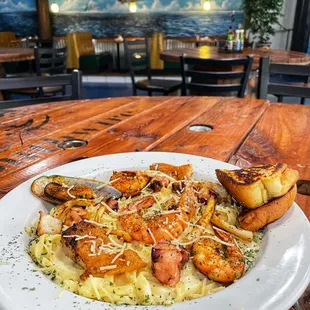 a plate of pasta and shrimp