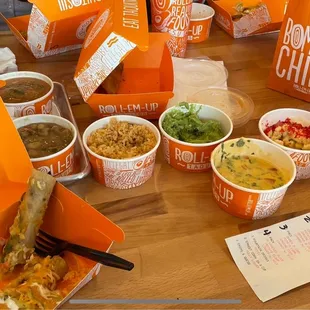 All the sides, fresh made salsa, cooked in house beans and rice, fresh made guacamole, queso sauce and corn in a cup fully loaded!