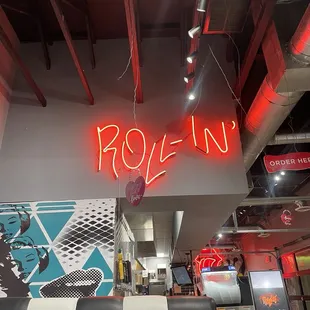 a neon sign in a restaurant