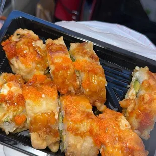 #1 deep fried roll. Has crab, cream cheese, avocado, spicy mayo on top. Masago on top as well.