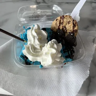 ows a piece of cake with whipped cream and chocolate