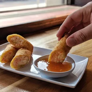Crab rangoons are our most popular side and are hand rolled when you order them