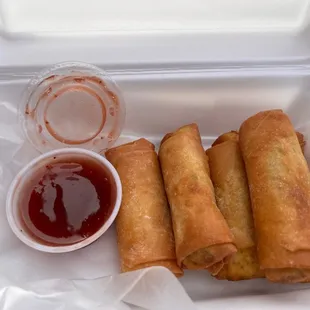  container of food with dipping sauce