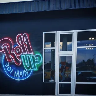  neon sign on the side of a building