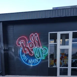  neon sign on the side of a building