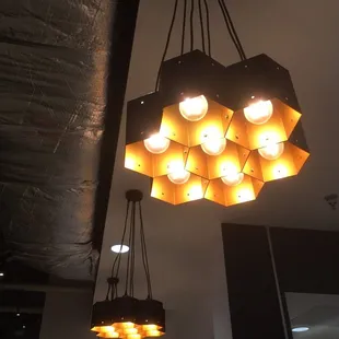 a chandelier with lights hanging from the ceiling