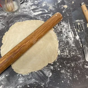 a rolling pin and dough