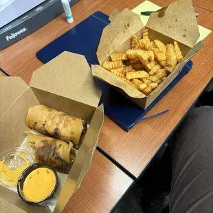 Chicken and Steak egg rolls with fries