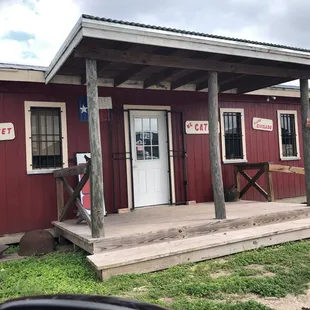 Look for a little red building. Blink and you'll miss it.