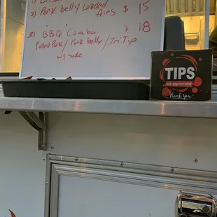 a menu on a food truck
