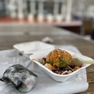 Deep fried half avo and tuna topped with aioli with tri colored cabbage plus a wrapped up warm spam masubi