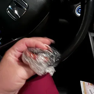  person holding a donut in their hand