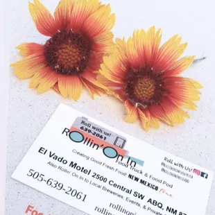 wo sunflowers and a business card