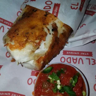 Burrito with ground beef, potatoes, beans, cheese with green chile