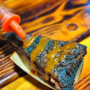  piece of bbq on a paper plate