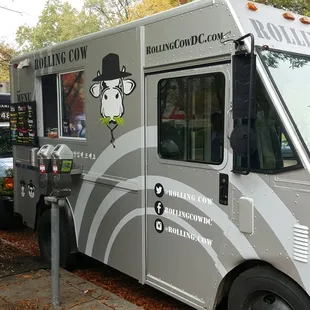 a man standing in front of a food truck