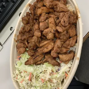a bowl of chicken and coleslaw