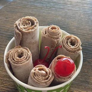 Chocolate ice cream with peanut butter and cherries.