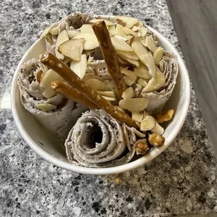 Coffee with brownie, almonds and pretzels