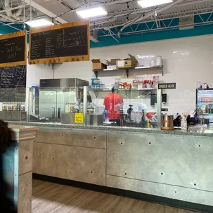 Employees making shakes and ice cream for customers who are not here.