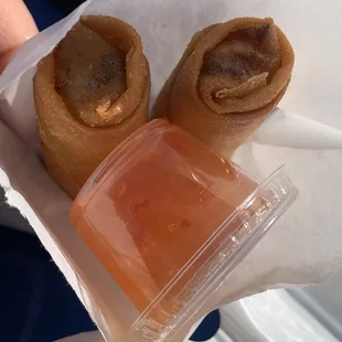 Two pieces of lumpia with the sweet chili sauce