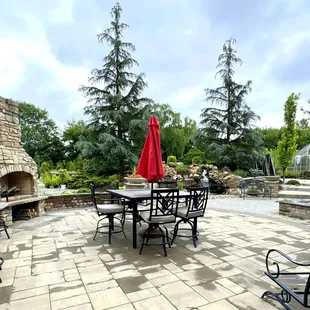 Nice Area Behind the Store with a Fireplace and a Waterfall