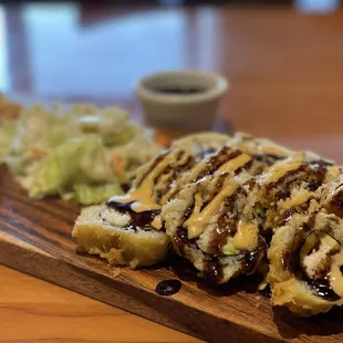 Golden Cali roll w avocado, crab meat and cucumber .