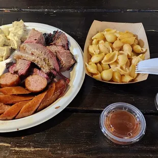 Brisket, burnt ends, honey smoked links.  Cole slaw, potato salad, and shells and cheese. YUM.