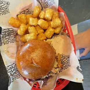 Pull pork sandwich with tater tots.