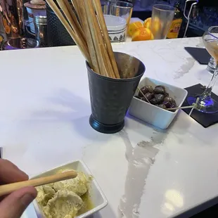 Breadsticks with rosemary-sage butter and marinated olives