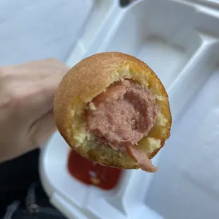 a half eaten hot dog