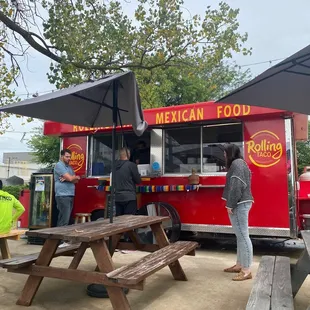 people ordering food from a food truck