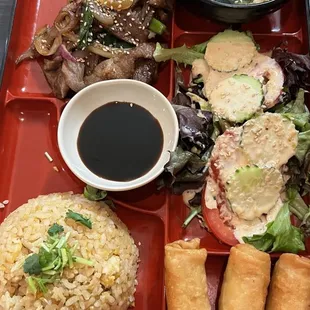 Bento Box: Teriyaki pork, fried rice, yakisoba, egg rolls.