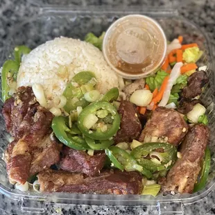 Crispy salt and pepper spare ribs-Twice cooked fried ribs!! I devoured it!!  Bomb sauce in that container pour it over everything!